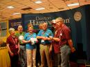 Lauren Clarke, KB1YDD, and Rick Roderick, K5UR, accept donations from the Dayton Amateur Radio Association.